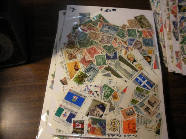 DEALER MASSIVE AMOUNT OF STAMPS SORTED INTO COUNTRIES UNCHECKED  